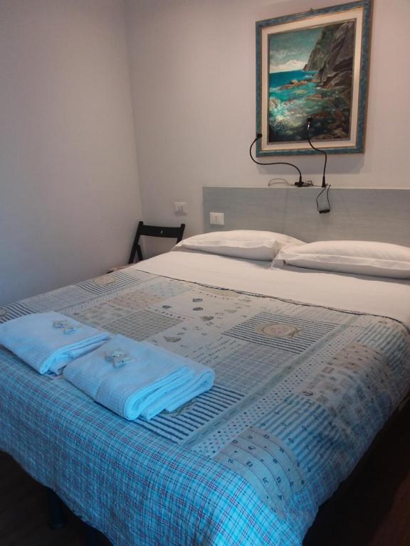 Postel nebo postele na pokoji v ubytování Rina Rooms