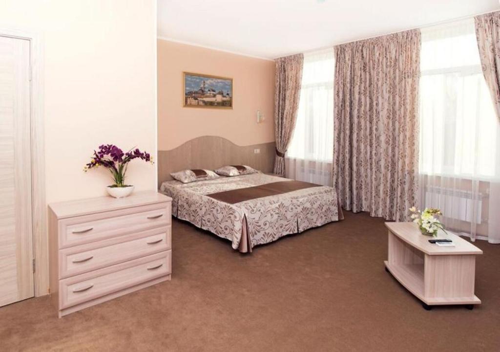 Кровать или кровати в номере Гостиница «Владимирская»