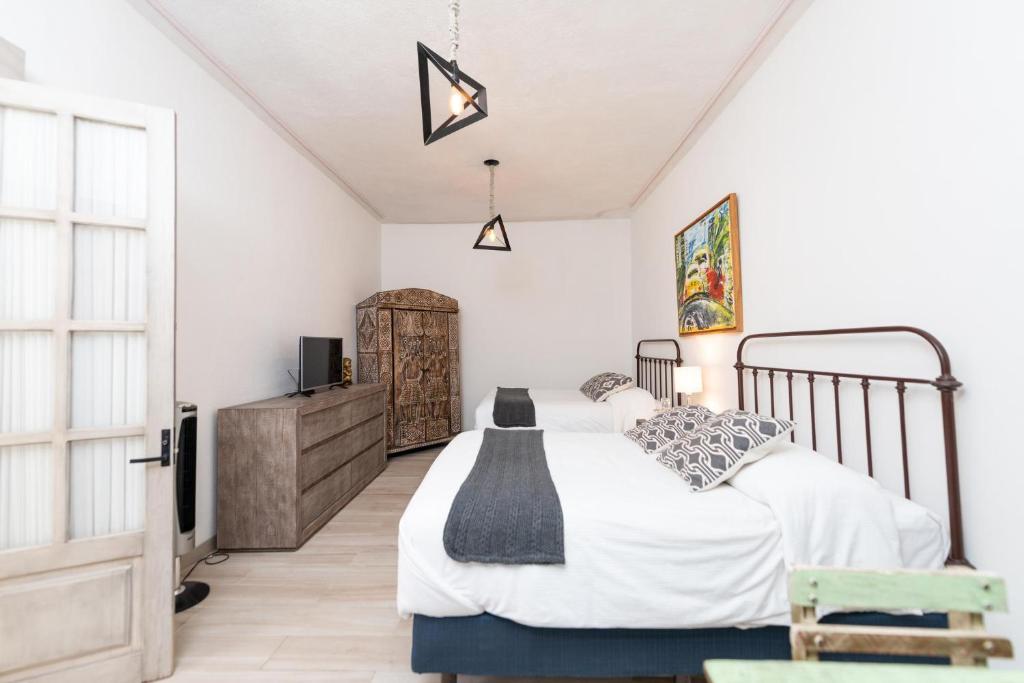 Postel nebo postele na pokoji v ubytování Casa De La O