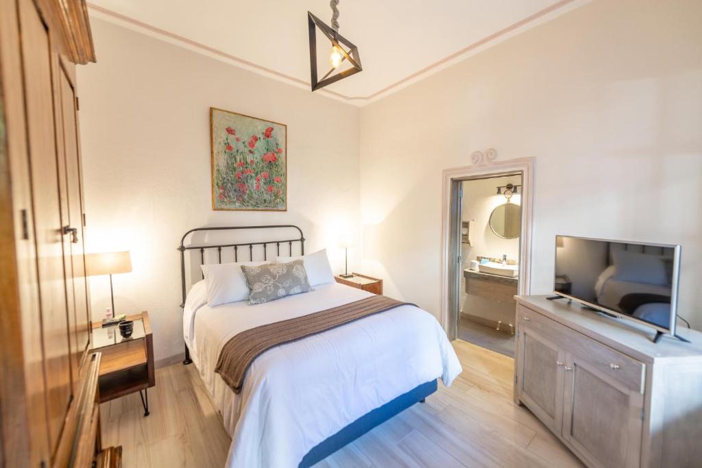 Postel nebo postele na pokoji v ubytování Casa De La O