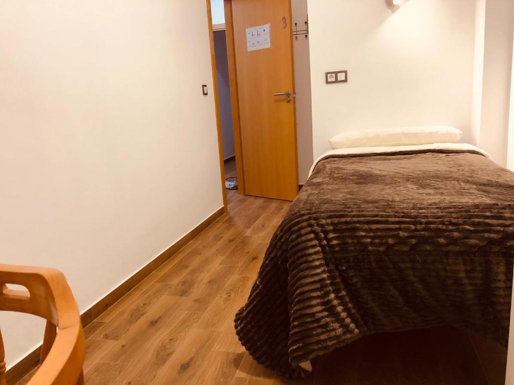 Postel nebo postele na pokoji v ubytování Low cost rooms La Merced