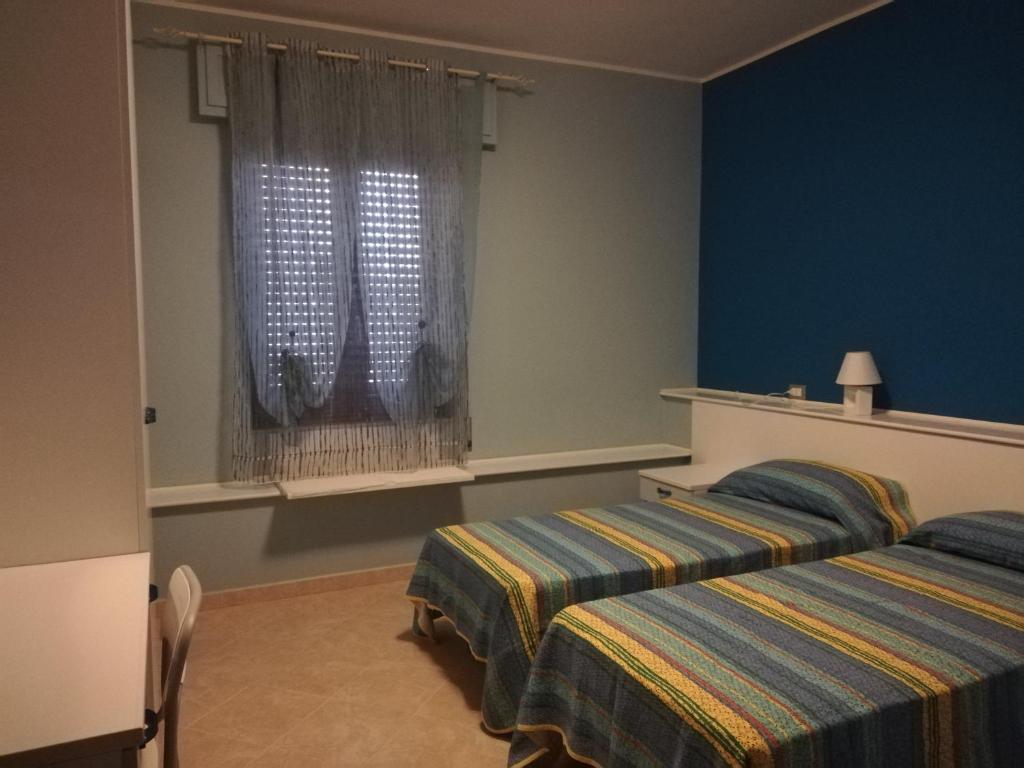 Postel nebo postele na pokoji v ubytování B&B Casa Mia