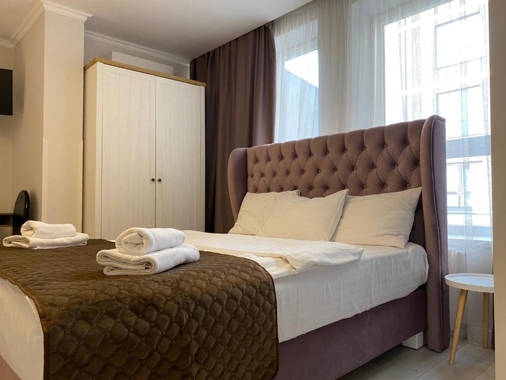 Letto o letti in una camera di Opera Center Hotel & Apartments