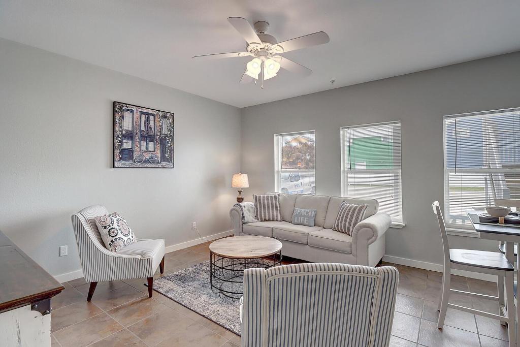 a living room with a couch and chairs and a table at A Piers to Be Tan in Port Aransas