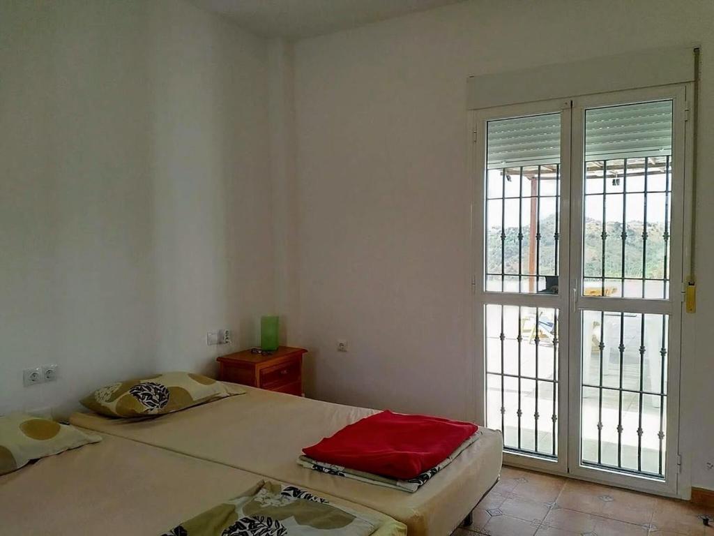 Łóżko lub łóżka w pokoju w obiekcie Belvilla by Oyo Casa de Aguila