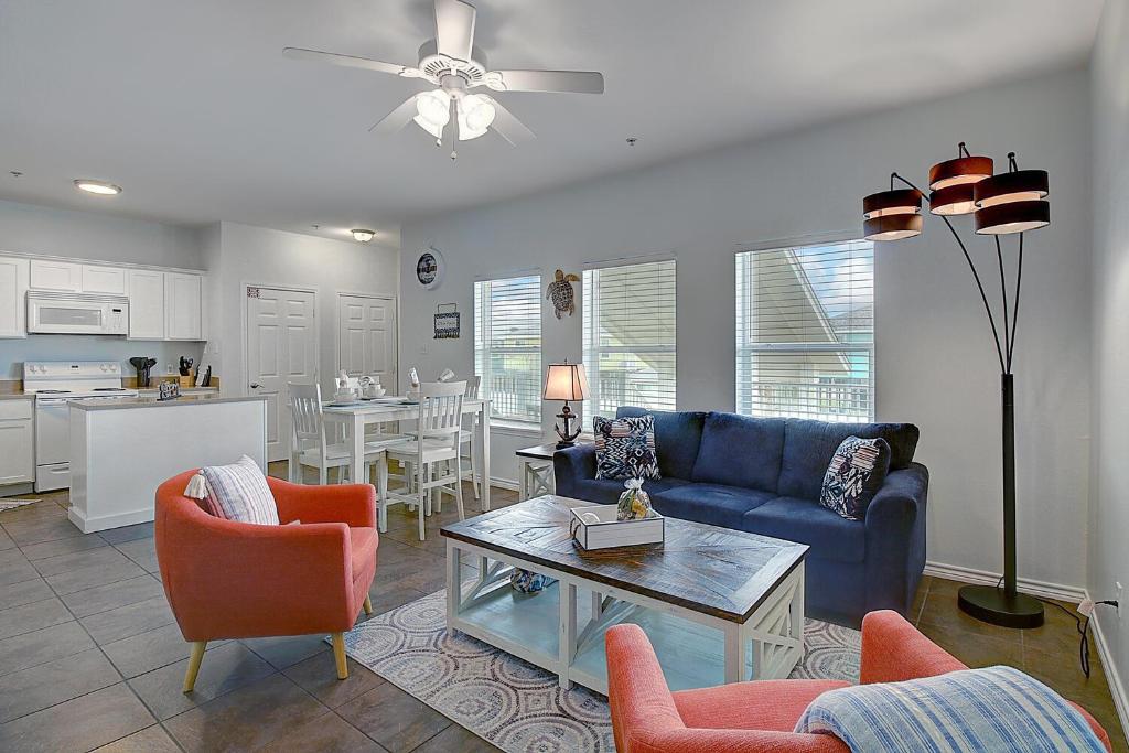 a living room with a couch and chairs and a table at Yachta-Yachta in Port Aransas