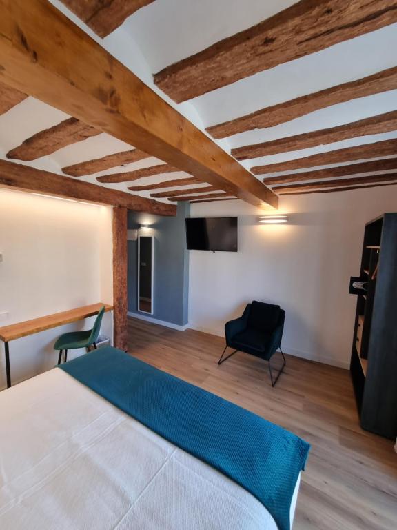 TV a/nebo společenská místnost v ubytování Hostal La Rúa