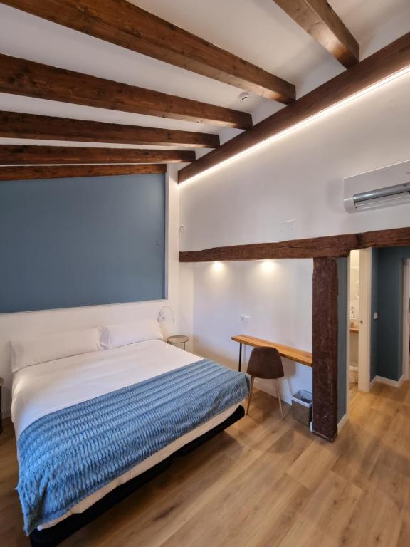 Postel nebo postele na pokoji v ubytování Hostal La Rúa