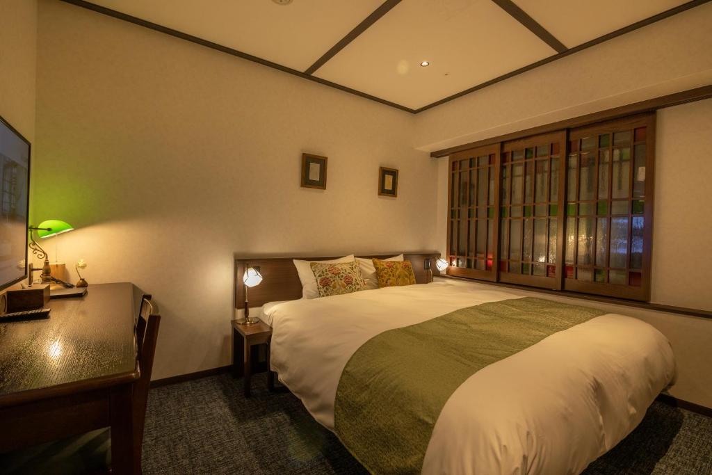 Postel nebo postele na pokoji v ubytování Hotel Aru Kyoto Sanjo Kiyamachi Do-ri
