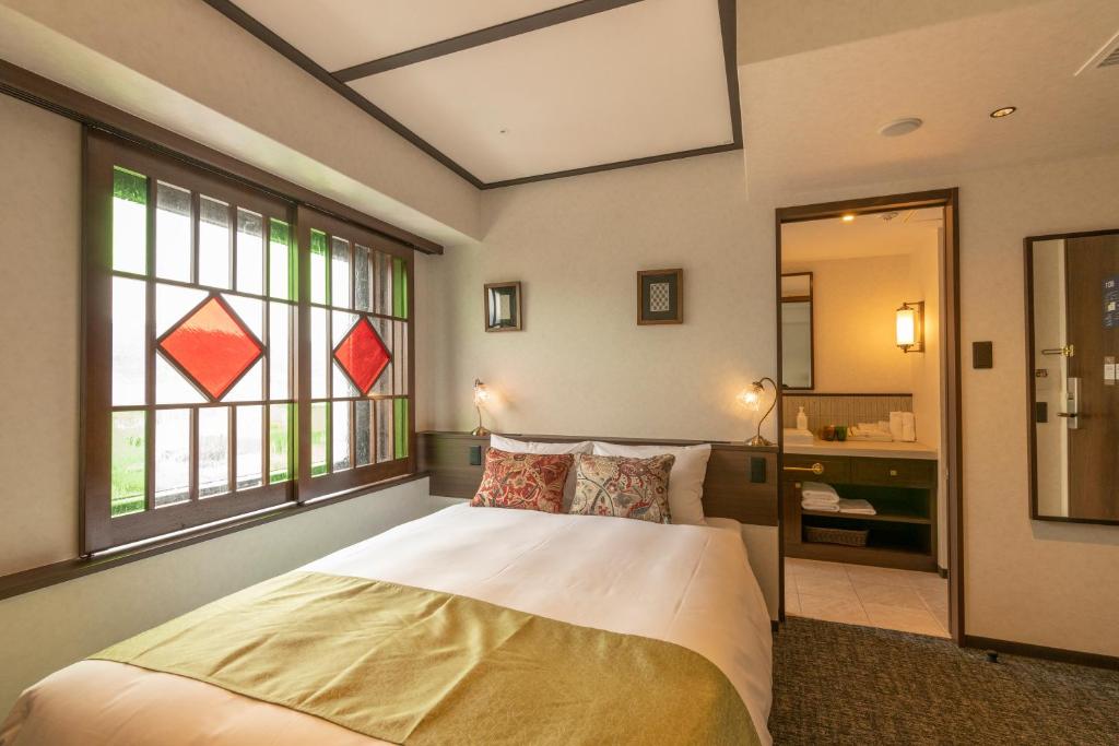 Postel nebo postele na pokoji v ubytování Hotel Aru Kyoto Sanjo Kiyamachi Do-ri