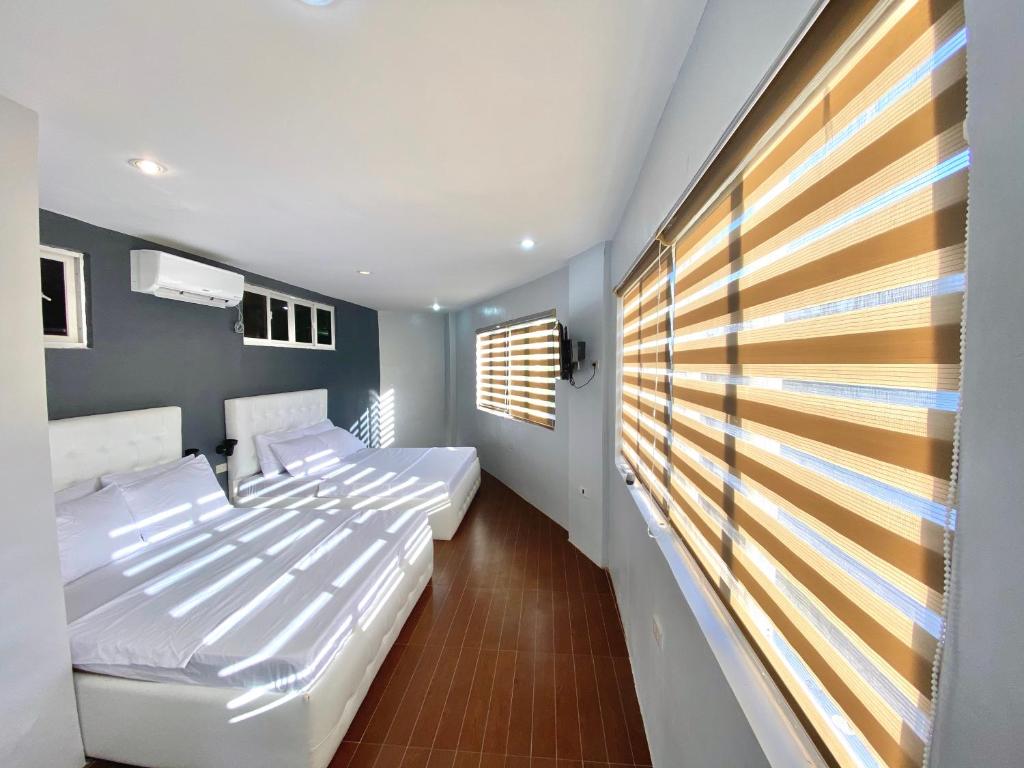 Postel nebo postele na pokoji v ubytování Viajeros Hostel Boracay