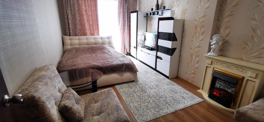 Кровать или кровати в номере Уют и комфорт Пермь