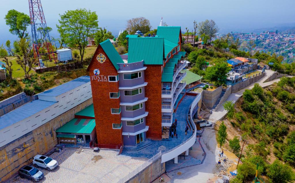 an overhead view of a building on a hill at juSTa Birding, Dharamshala in Dharamshala