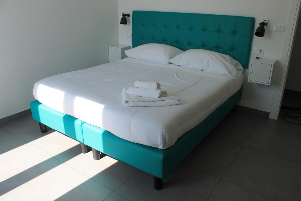 Łóżko lub łóżka w pokoju w obiekcie Life Quality B&B