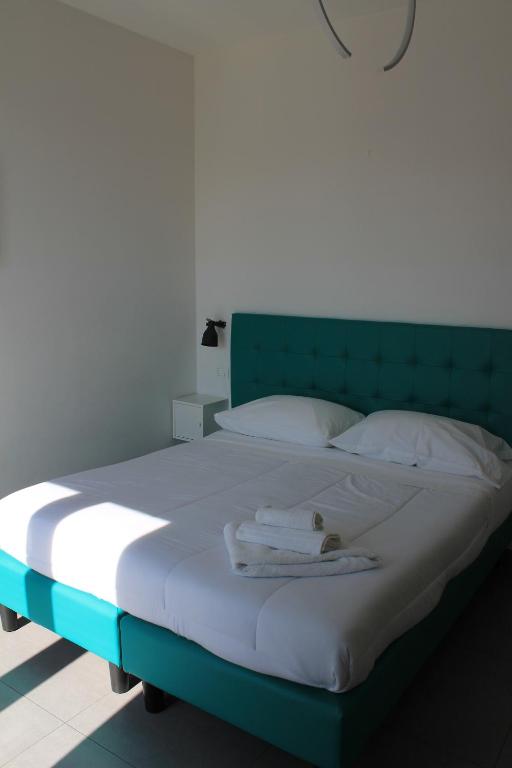 Łóżko lub łóżka w pokoju w obiekcie Life Quality B&B