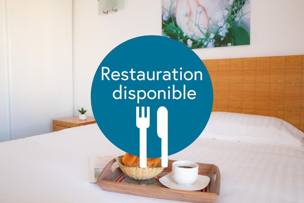 Postel nebo postele na pokoji v ubytování Comfort Aparthotel Mutzig Portes d'Alsace