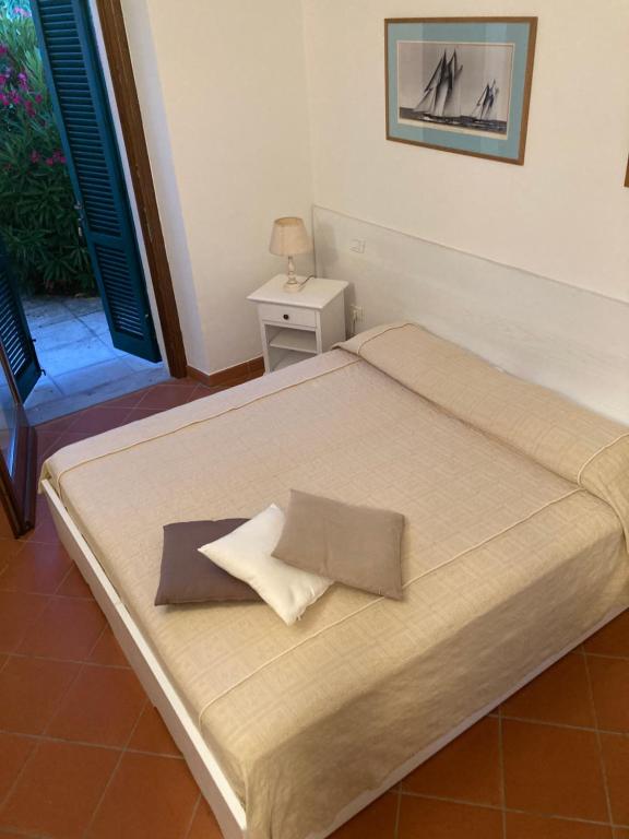 En eller flere senger på et rom på Villa Borgeri