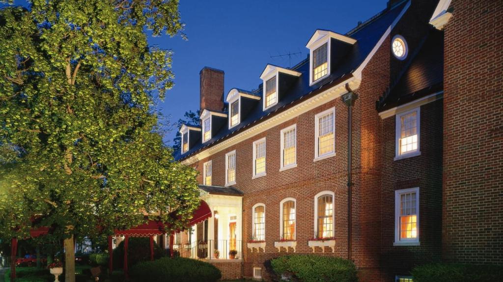 a large brick building with a clock on the side of it at The Exeter Inn in Exeter