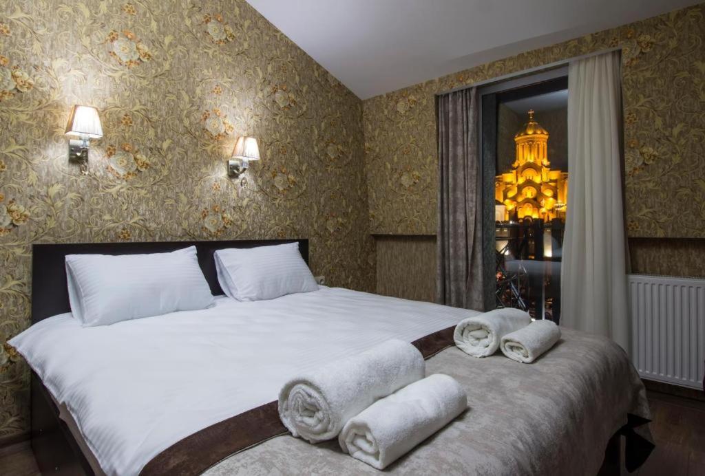 Postel nebo postele na pokoji v ubytování MariaLuis Hotel