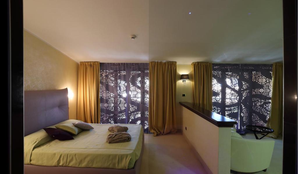 Postel nebo postele na pokoji v ubytování Grand Hotel Paradiso