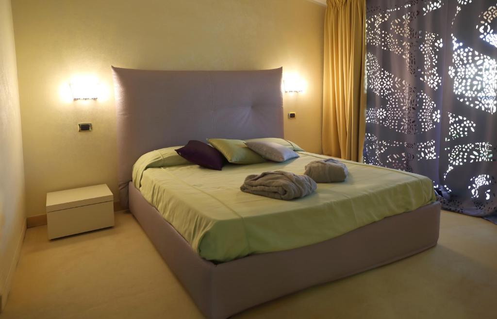 Postel nebo postele na pokoji v ubytování Grand Hotel Paradiso