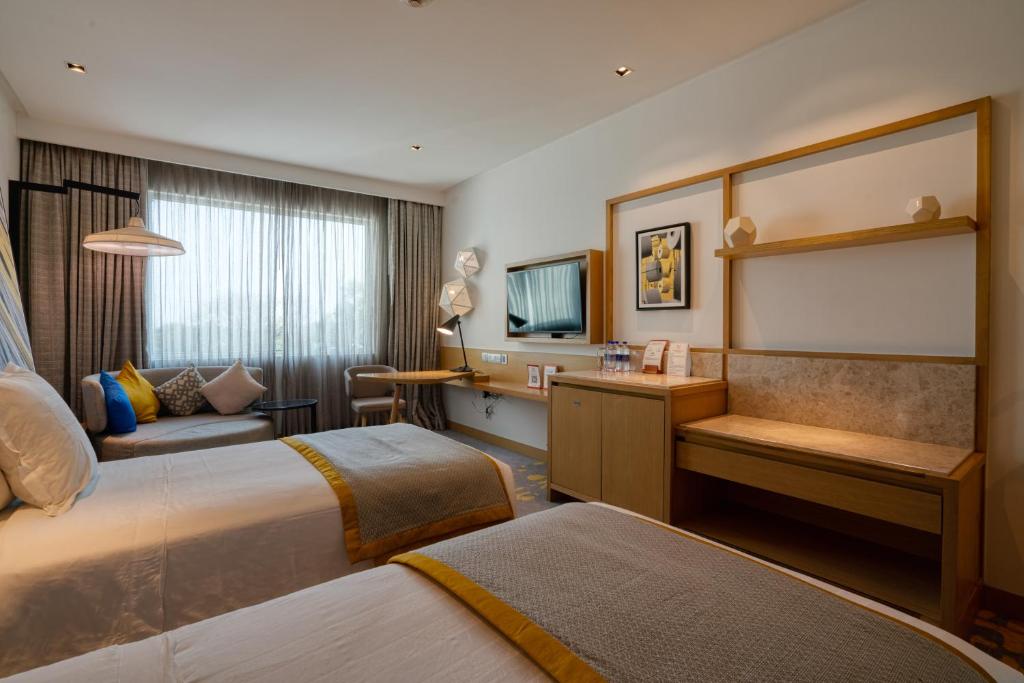Postel nebo postele na pokoji v ubytování Welcomhotel by ITC Hotels, RaceCourse, Coimbatore