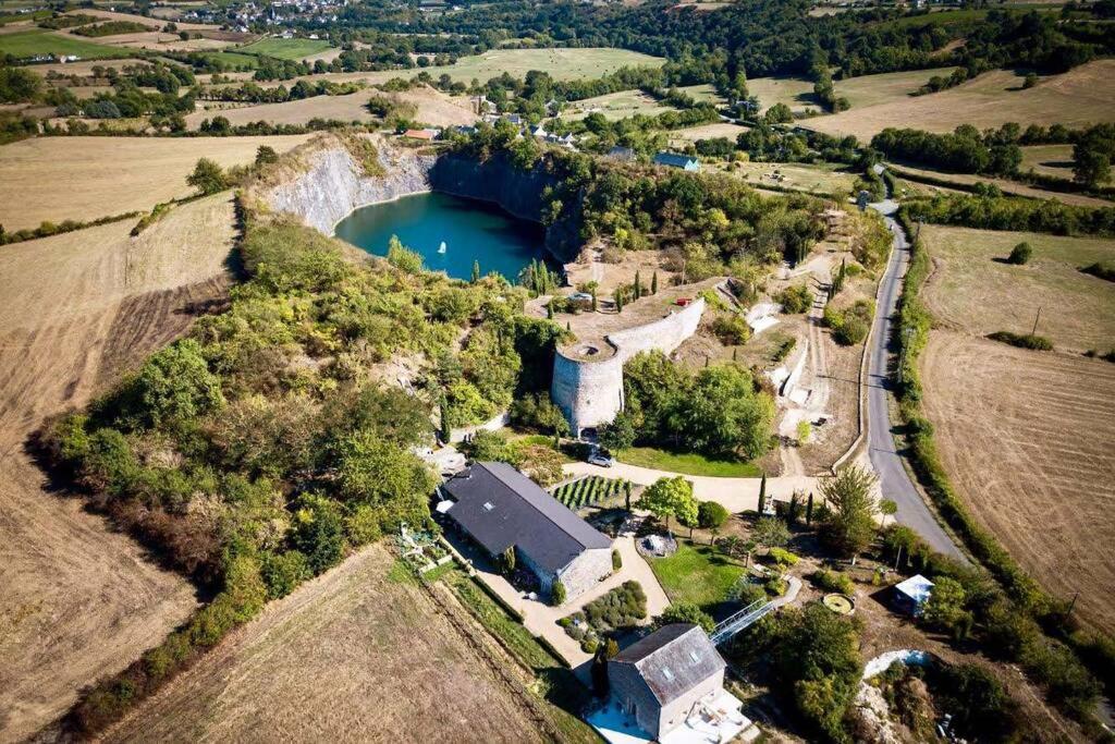 an aerial view of a house and a lake at Au coeur de la Toscane Angevine in Chaudefonds-sur-Layon