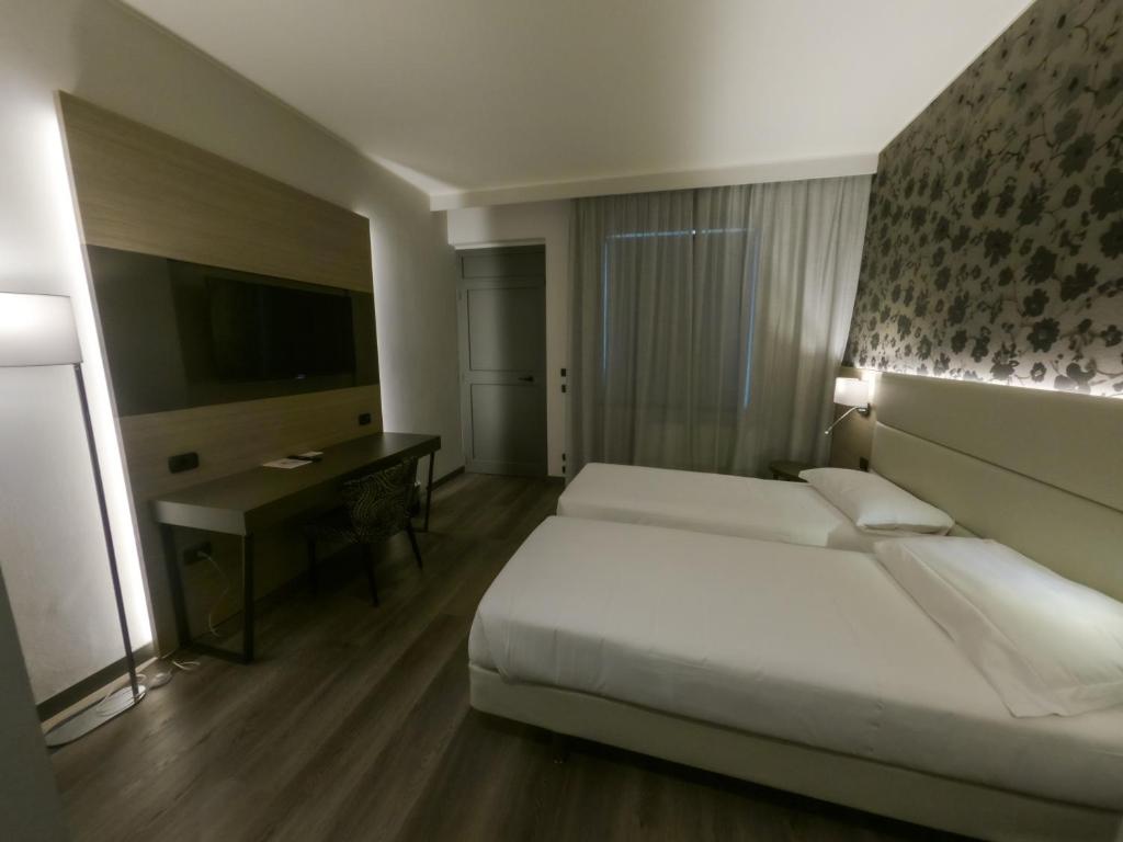 Postel nebo postele na pokoji v ubytování Hotel Sirio - Sure Hotel Collection by Best Western