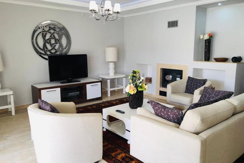 A television and/or entertainment centre at Fun&Sun Luxury River Villa With Amazing Landscape