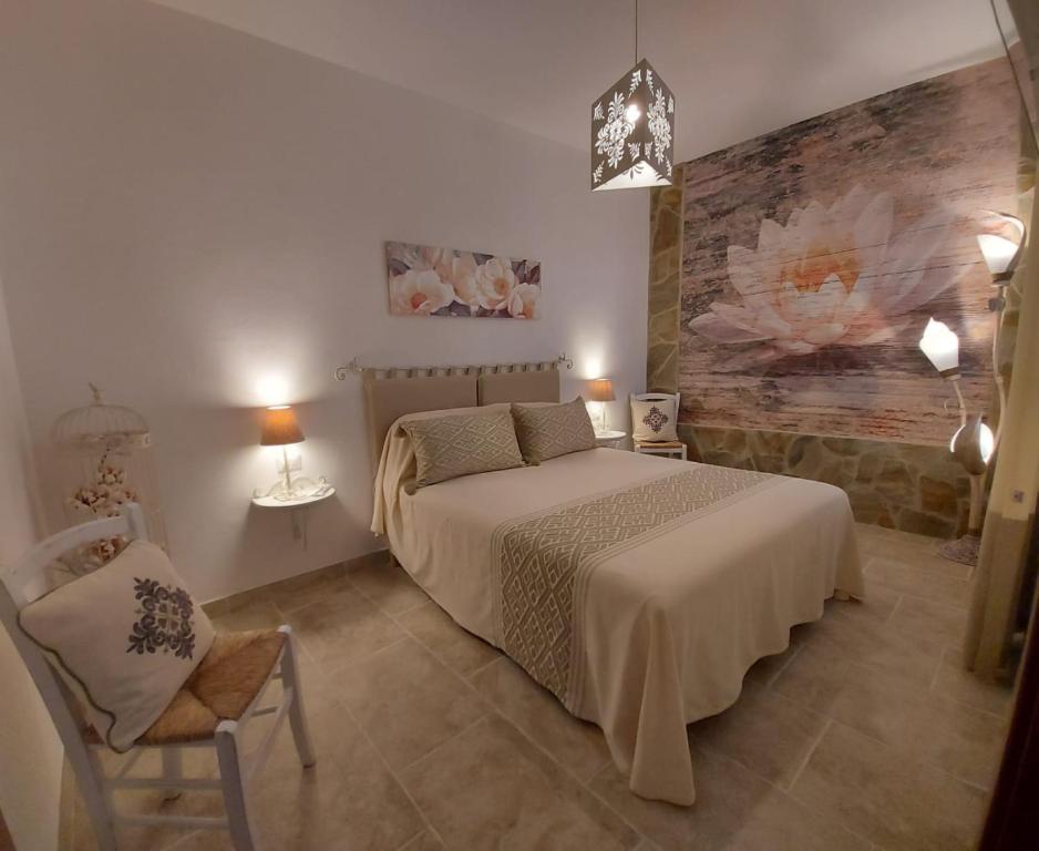 A bed or beds in a room at La Casedda di Catalina
