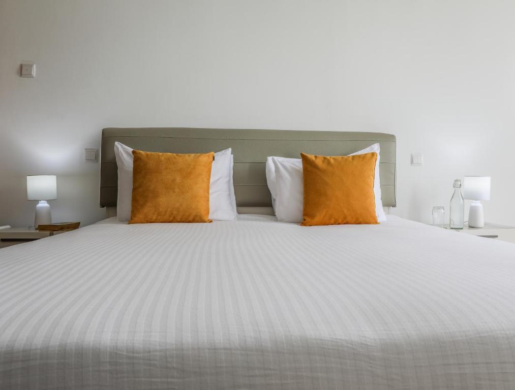 Кровать или кровати в номере Enclave Apartments Kilimani by YourHost, Nairobi