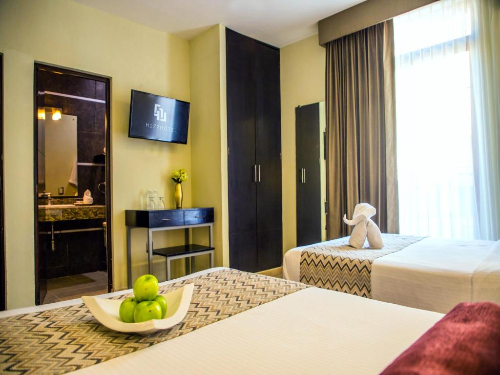 Postel nebo postele na pokoji v ubytování H177 Hotel