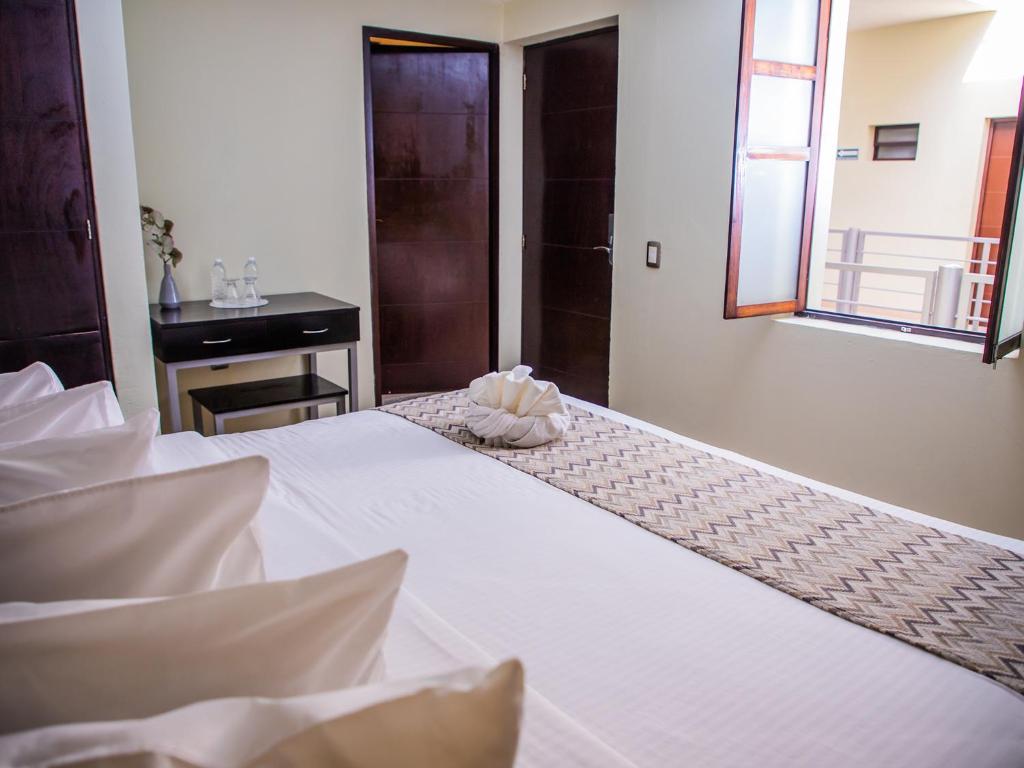 Postel nebo postele na pokoji v ubytování H177 Hotel