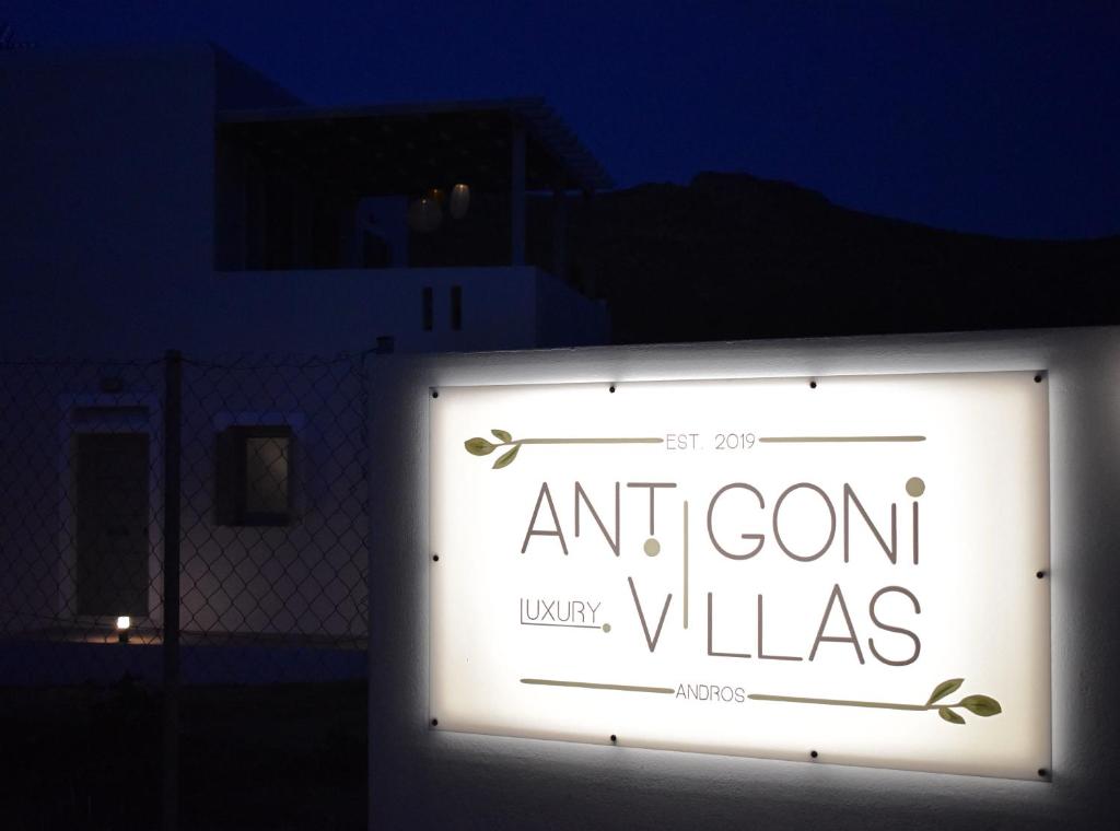 a sign that reads and corn villas in the dark at Antigoni Villas in Gavrio