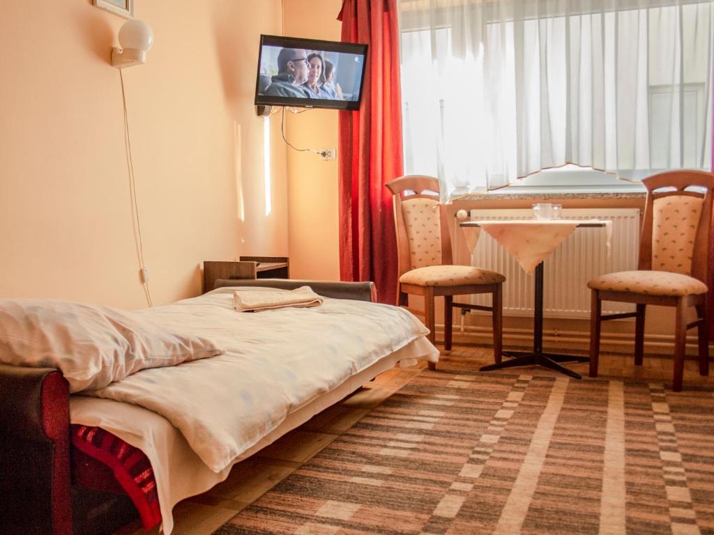 Postel nebo postele na pokoji v ubytování Zajazd Zacisze
