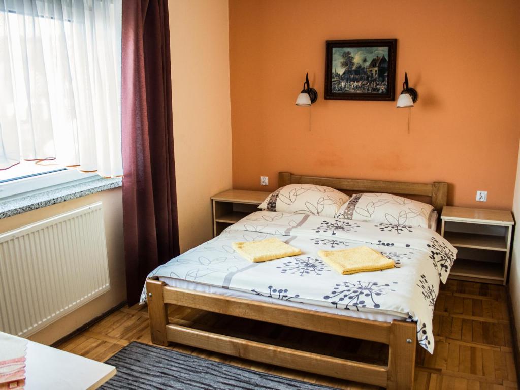 Postel nebo postele na pokoji v ubytování Zajazd Zacisze