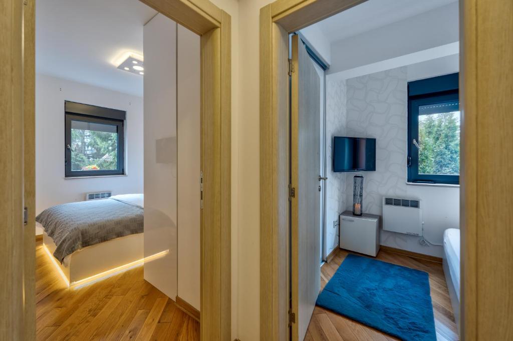 Krevet ili kreveti u jedinici u okviru objekta Centar M LUX Zlatibor