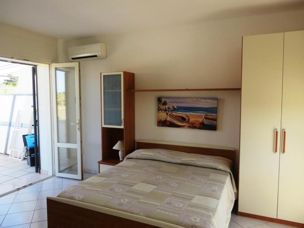 Postel nebo postele na pokoji v ubytování I tulipani di Torre Pali