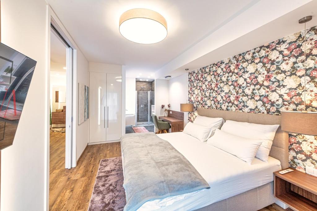 Postel nebo postele na pokoji v ubytování VIVA Apartments