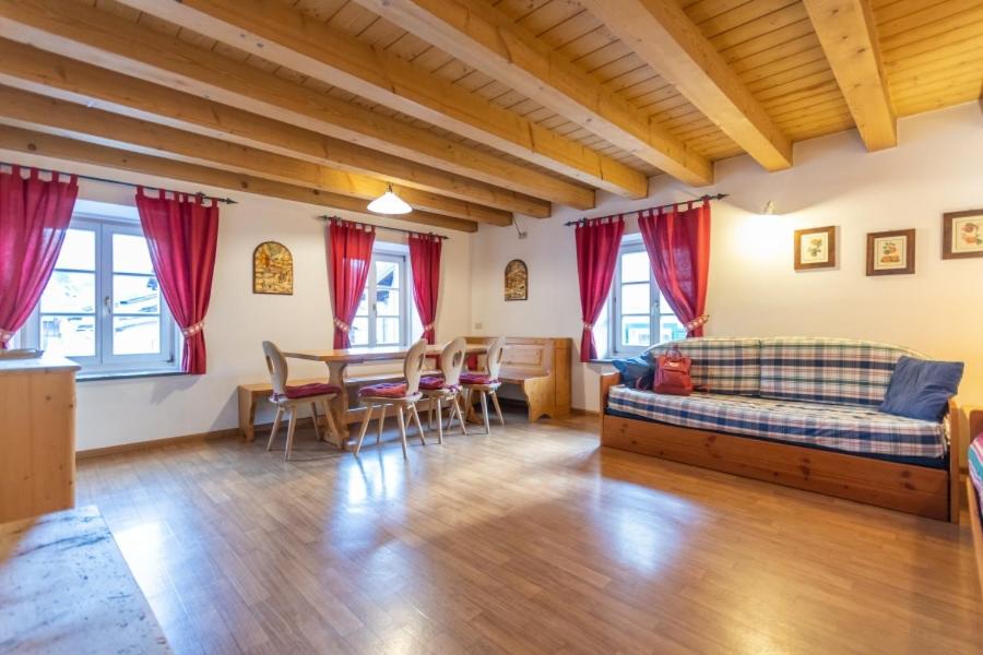 a living room with a couch and a table at Appartamento Vernelia Val di Fassa Sella Ronda in Campitello di Fassa