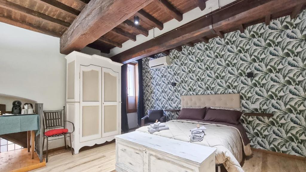 Postel nebo postele na pokoji v ubytování Residenza dei Longobardi Affittacamere