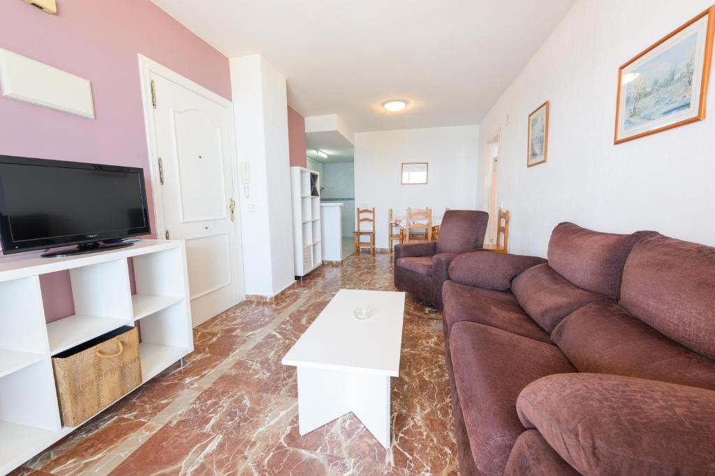Televízia a/alebo spoločenská miestnosť v ubytovaní Apartamentos Nuevo México C 131