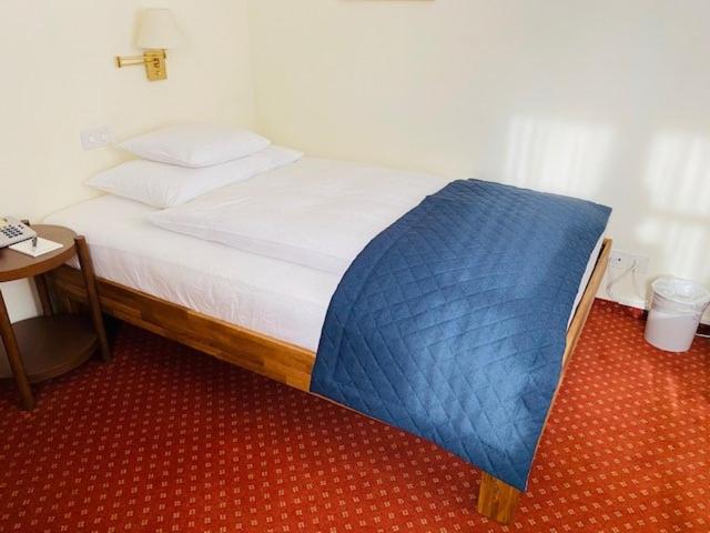 Postel nebo postele na pokoji v ubytování Hotel Maria