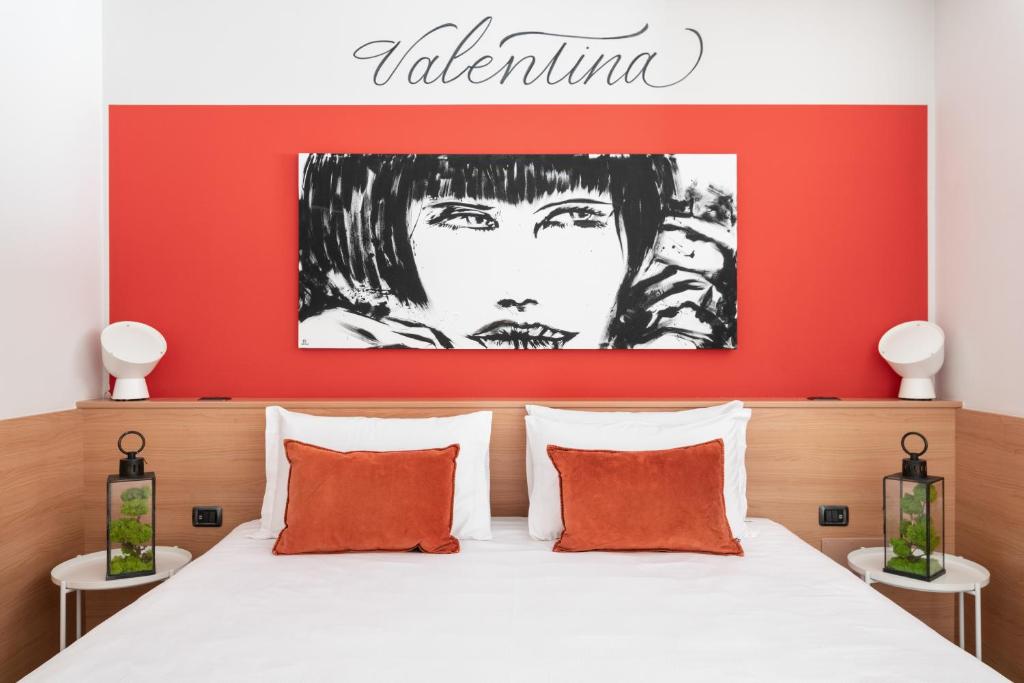 Postel nebo postele na pokoji v ubytování Hotel Borgo Brianteo