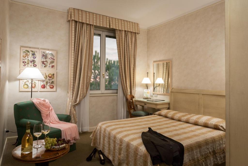 Postel nebo postele na pokoji v ubytování Hotel Selva Candida