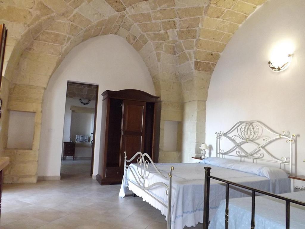 Postel nebo postele na pokoji v ubytování Masseria Cricelli
