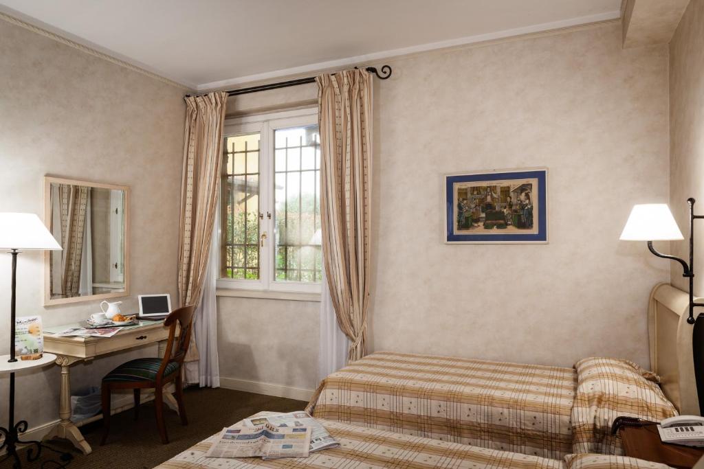 Postel nebo postele na pokoji v ubytování Hotel Selva Candida