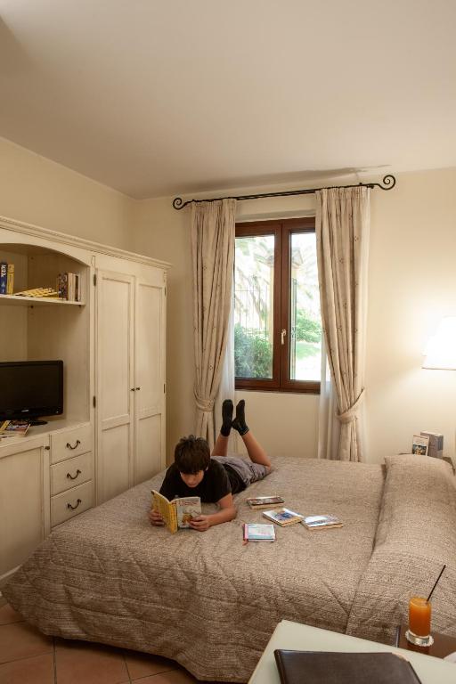 Postel nebo postele na pokoji v ubytování Hotel Selva Candida