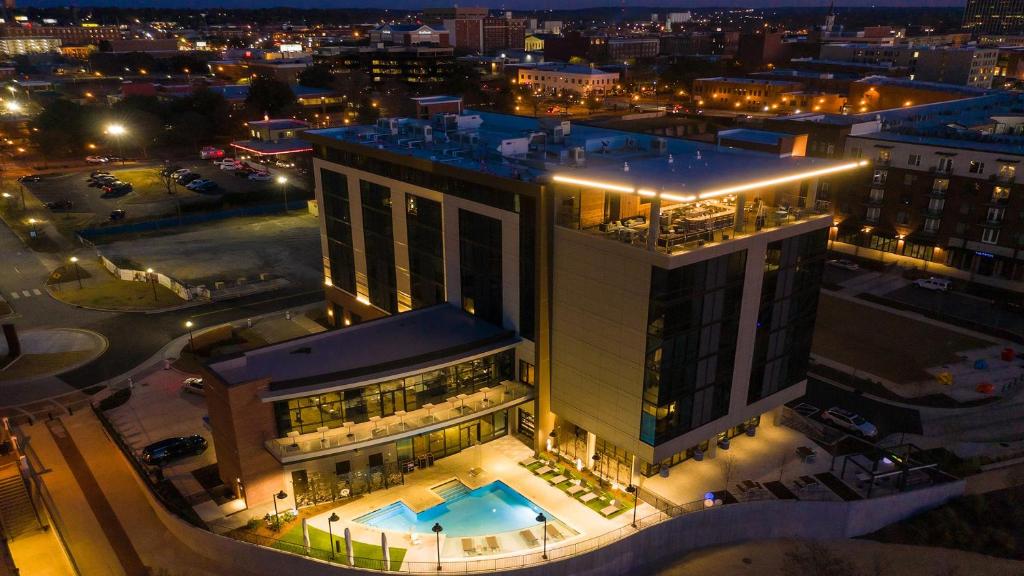 an aerial view of a building with a pool at Hotel Indigo - Columbus at Riverfront Place, an IHG Hotel in Columbus