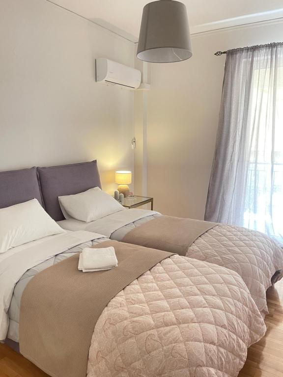 Posteľ alebo postele v izbe v ubytovaní Cassiopeia - Glyfada Apartment